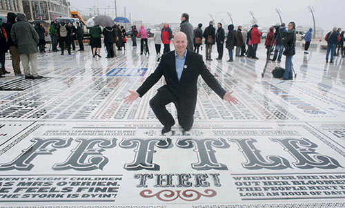 Graphic designer Andy Altmann of Why Not Associates, London, presents the Comedy Carpet he helped create.