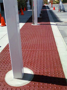 After cleaning the concrete surface and precutting the mat to the desired size, remove any unwanted domes.