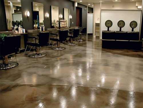 An epoxy floor in a salon in grays and browns.
