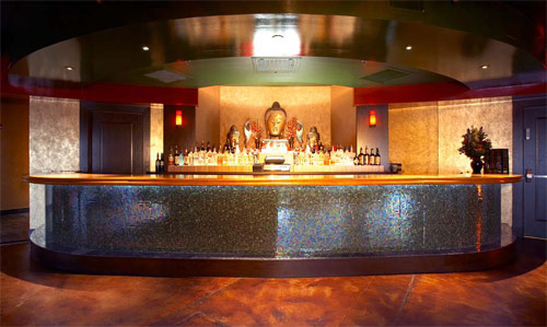 Using glass-fiber reinforced concrete (GFRC) in a yellow color, Klipfel cast the bar top on a melamine board surface.