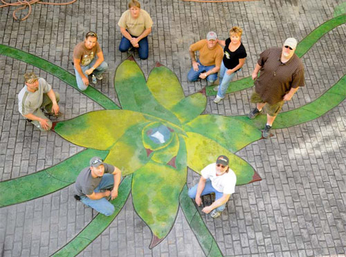 Bob and Lee Ann Harris led volunteers and workshop participants in completing the Aloe Vera Courtyard at the Children's Museum of Phoenix. Materials came from Brickform, Smith Paints and Borders Construction Specialties. Hanson Aggregates of Arizona donated concrete.