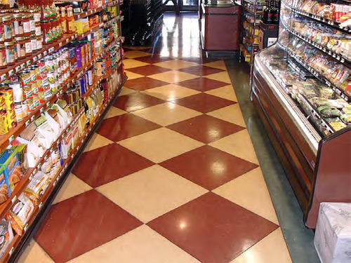 Red and cream checkerboard pattern on concrete in this retail store.