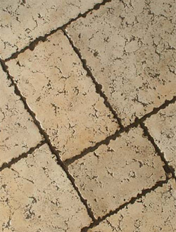 This grouted stamp technique delivers a finished surface that is nearly indistinguishable from actual travertine tiles.