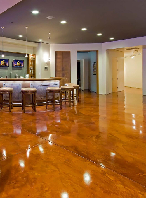A high-sheen concrete floor in a brown acid stain.