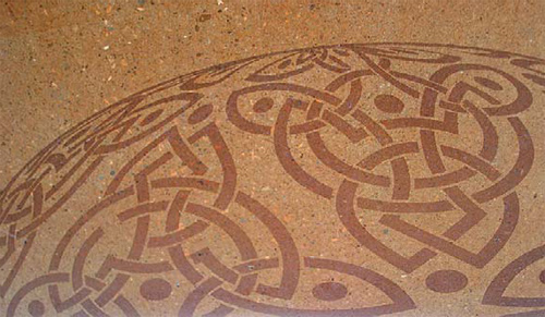 Stenciled concrete in a trinity/celtic rope pattern.
