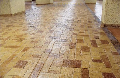 Stamped concrete overlay inside a parking garage.
